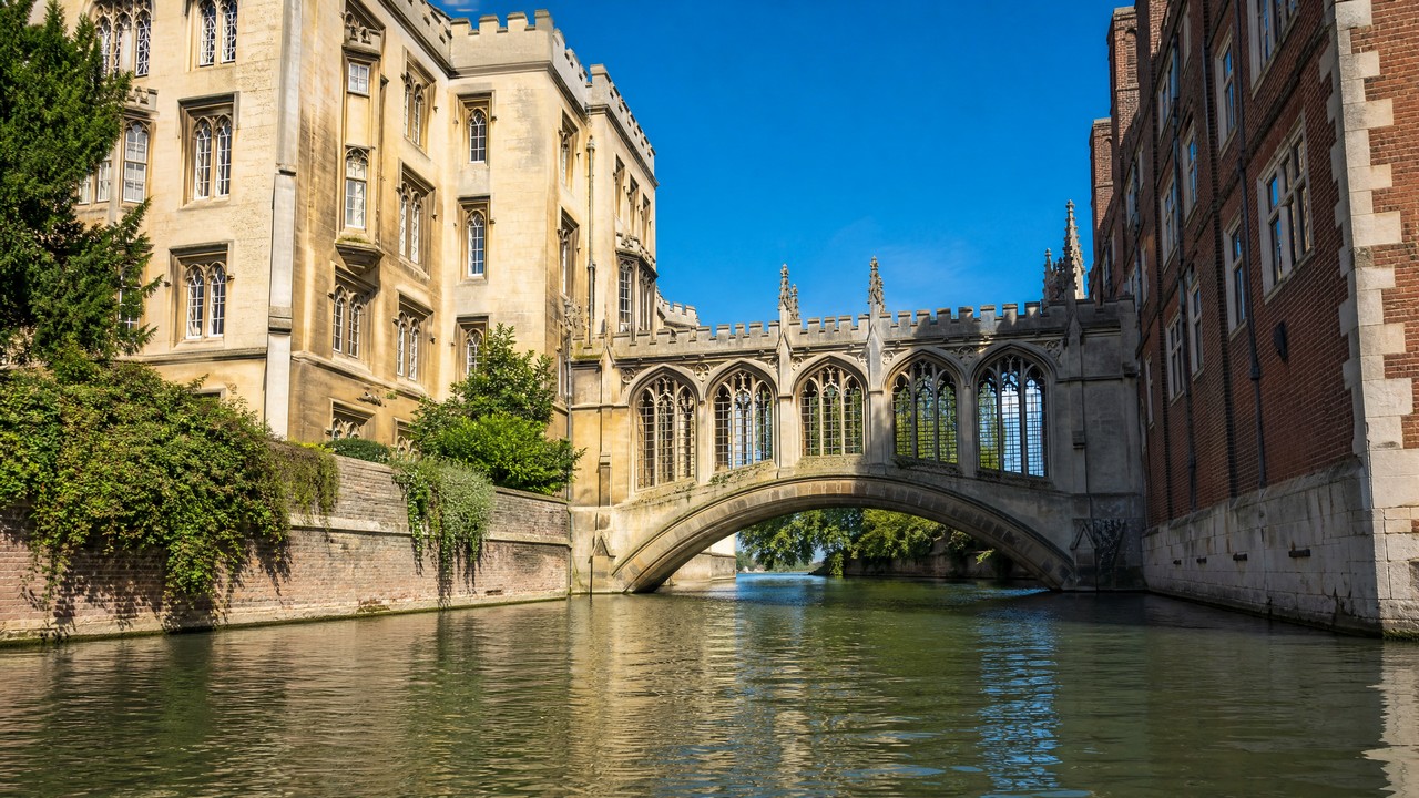 The Bridge of Sighs in Cambridge is located within St John's College, spanning the River Cam to connect the old and new courtyards. It is a Victorian-style covered bridge, famous for its appearance in the film Chariots of Fire.